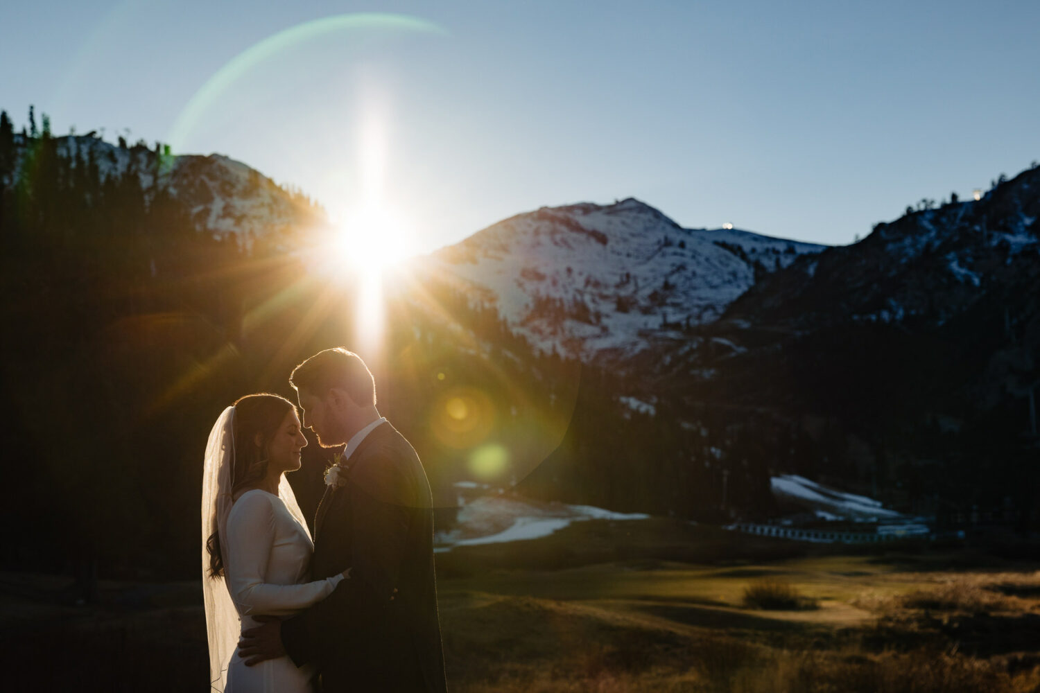 A bride and groom enjoy a romantic moment during their Everline Resort sunset photos session.