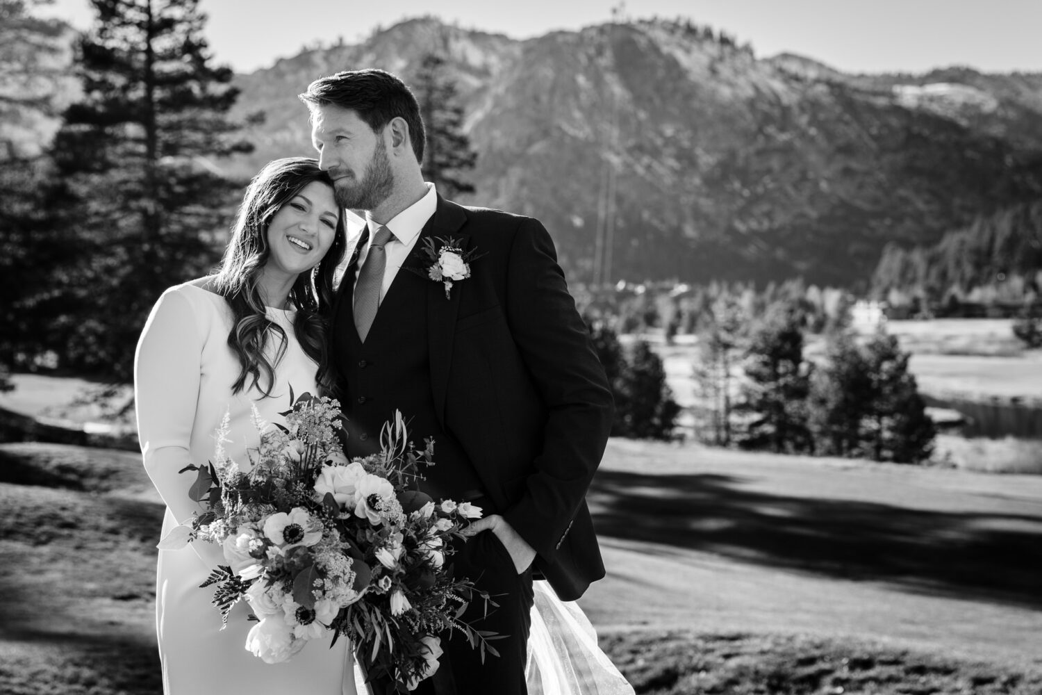 A bride and groom that decided to get married at Everline Resort & Spa enjoy a romantic moment together in Olympic Valley.