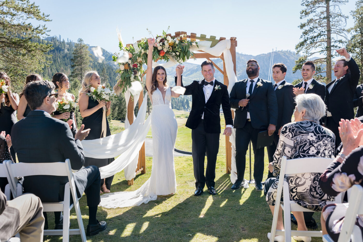 A moment of celebration at an Everline Resort wedding, captured by candid photographer Chris Werner. 