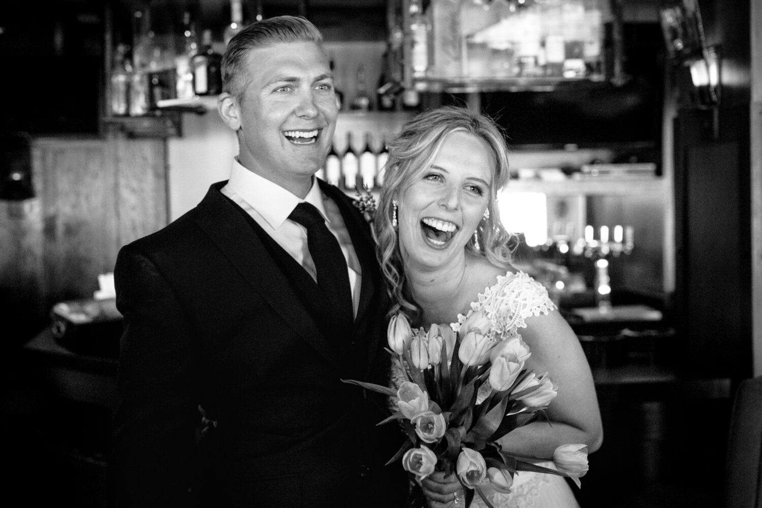 A joyous bride and groom celebrate at their Sunnyside Resort wedding in Tahoe City.