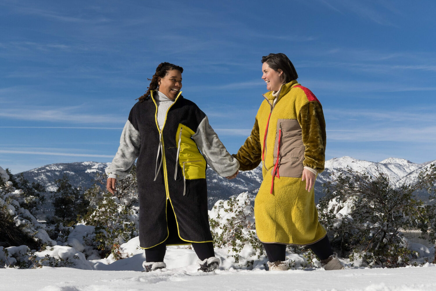 Matching long UGG Marlene Sherpa fleece jackets for an LGBT engagement photoshoot.