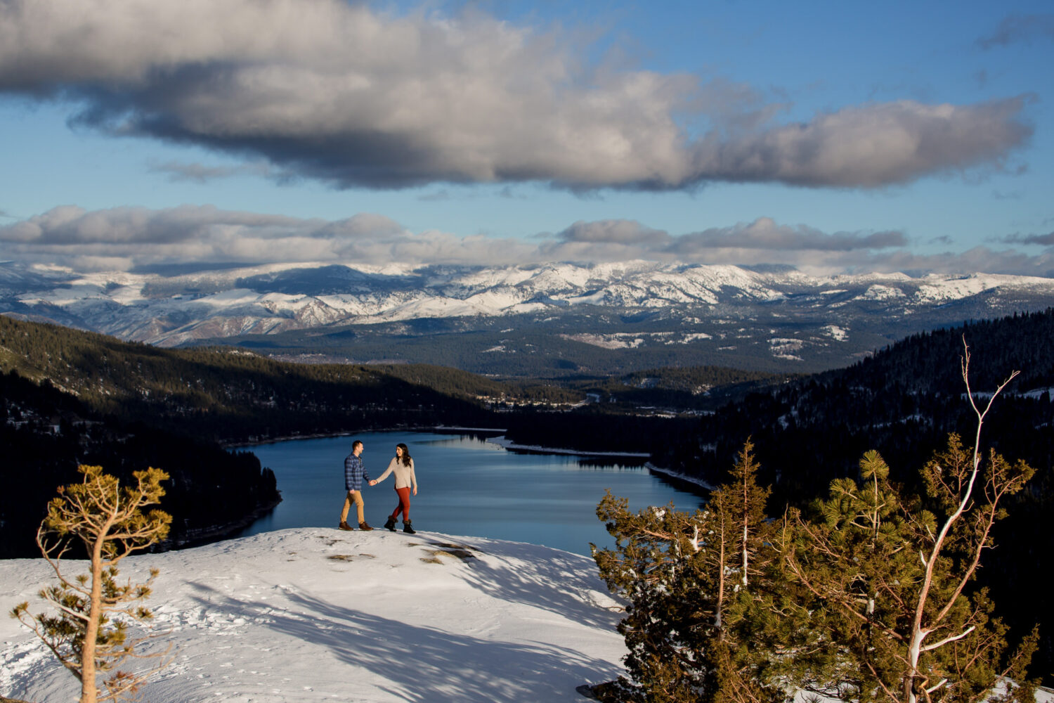 Exploring a winter landscape during a Truckee couples portrait session.