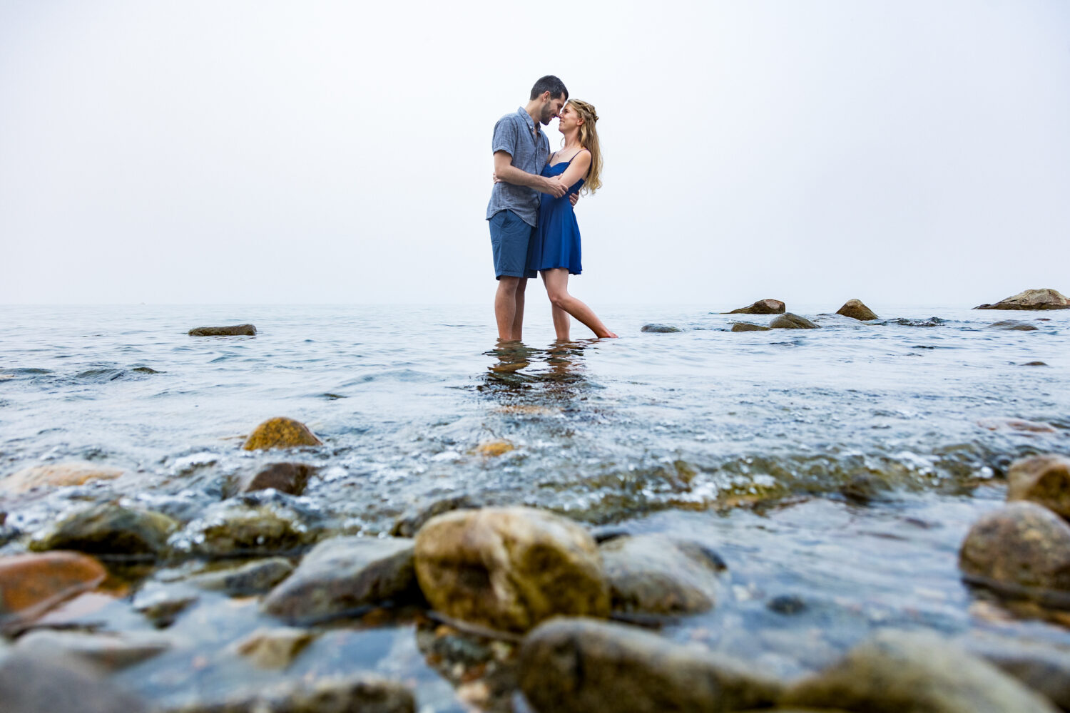 A barefoot engagement photo session at a beach in Lake Tahoe.