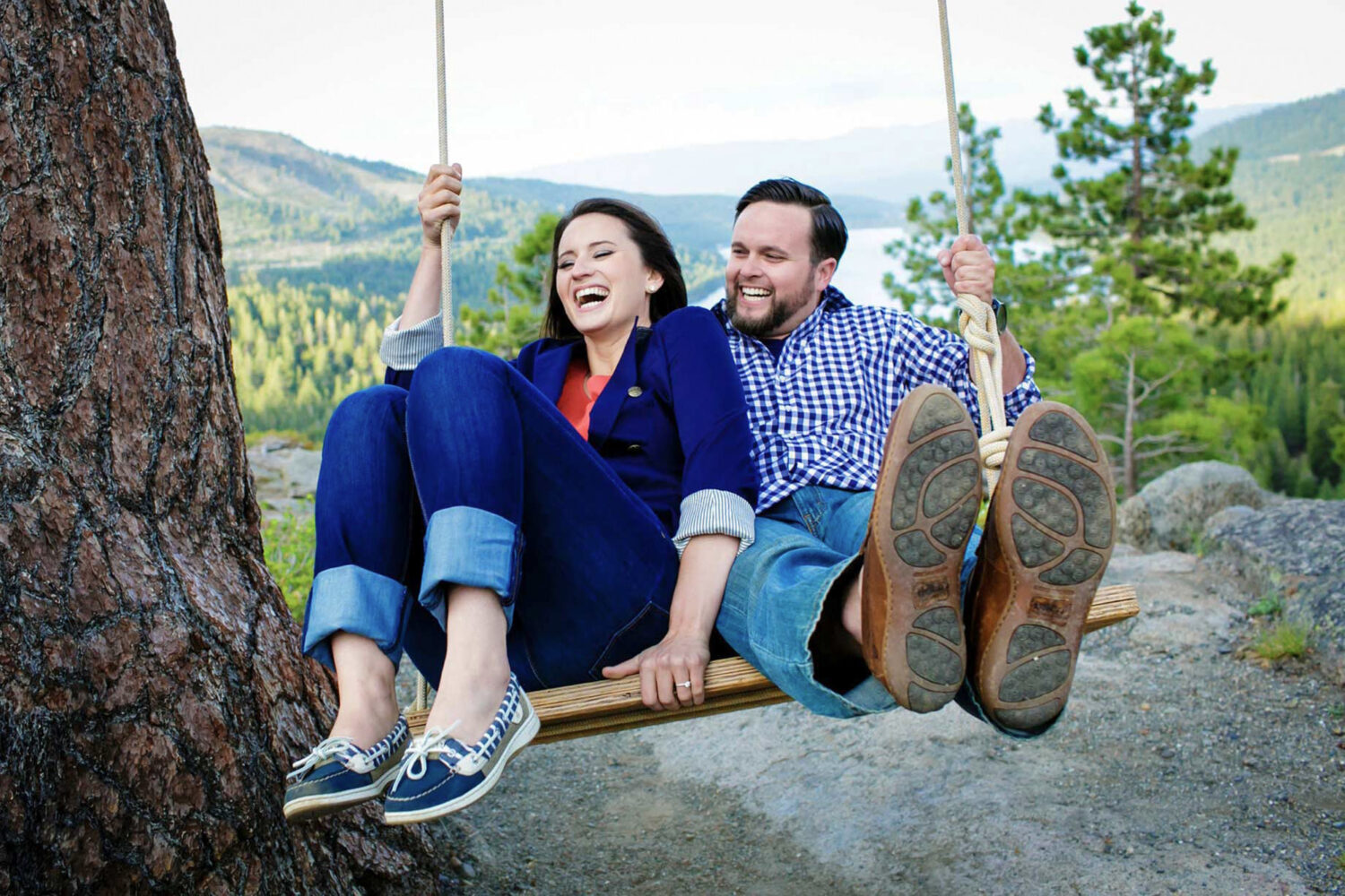 A couple enjoys a moment on the wooden swing on Old Highway 40 above Donner Lake.