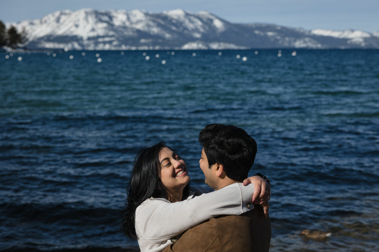 A couple enjoys a private engagement photoshoot in Tahoe during winter.