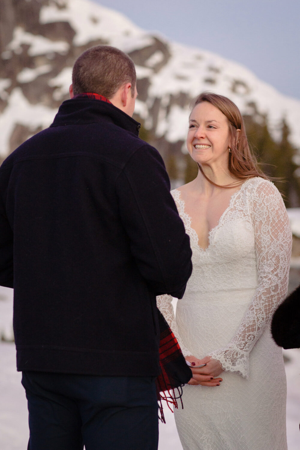 A bride smiling joyfully, shot by a Tahoe photographer good at capturing candid moments.